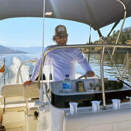 Mike Monastra at the wheel of his boat.